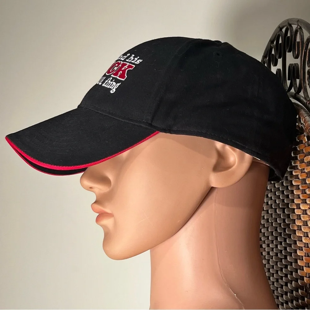 A one size fits all Black ball Cap 